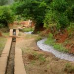 Diverting water from a stream into a furrow during the dry season, Bangalala Village in Same District, Tanzania Diverting water from a stream into a furrow during the dry season, Bangalala Village in Same District, Tanzania